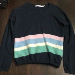 Navy blue sweater with pastel stripes